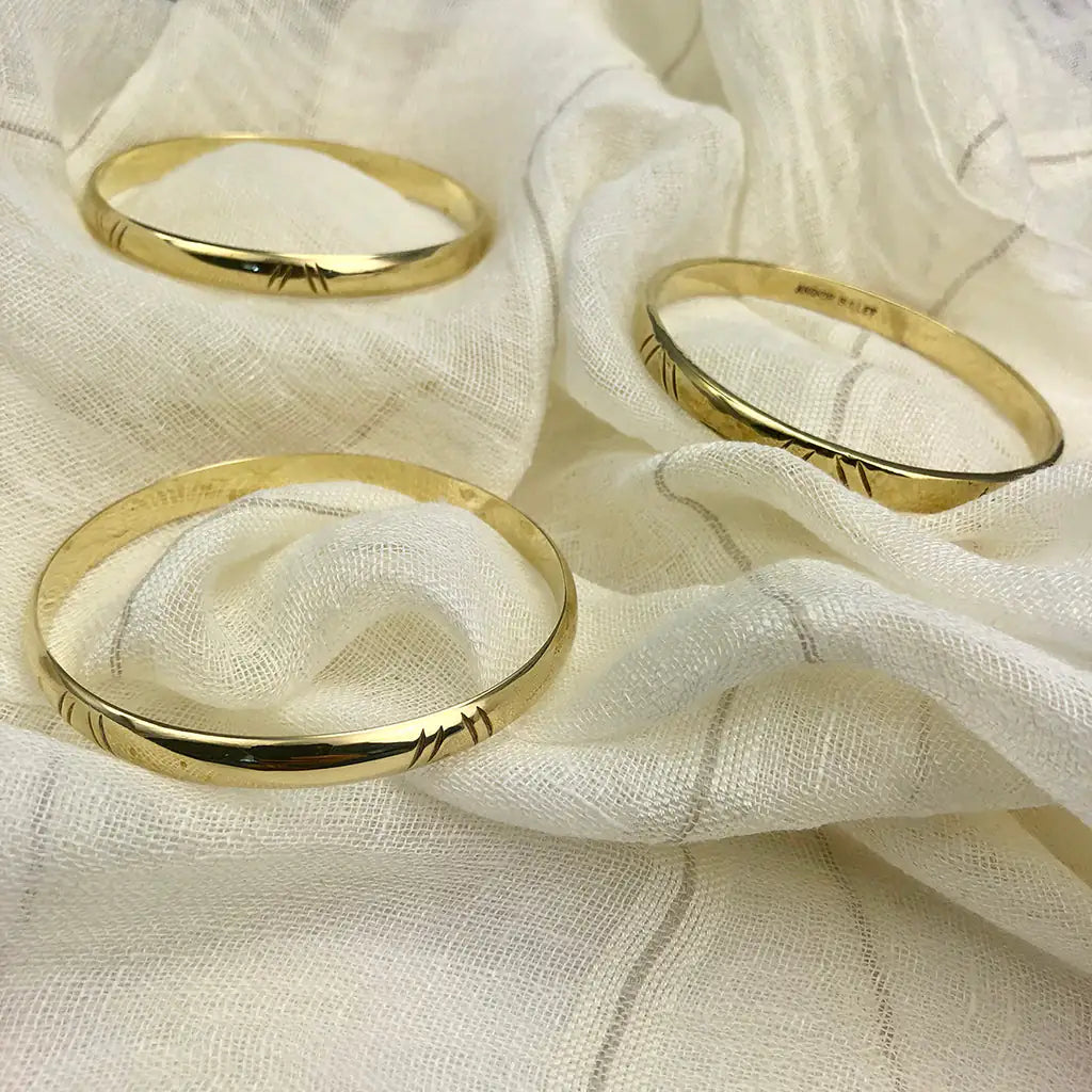 Carved Bombshell Brass Bangle